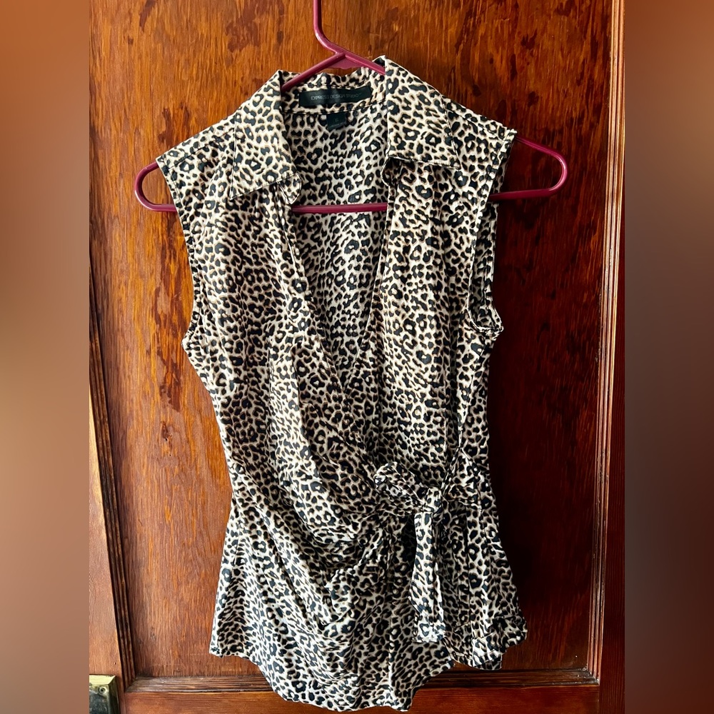 Sleeveless leopard print wrap blouse.